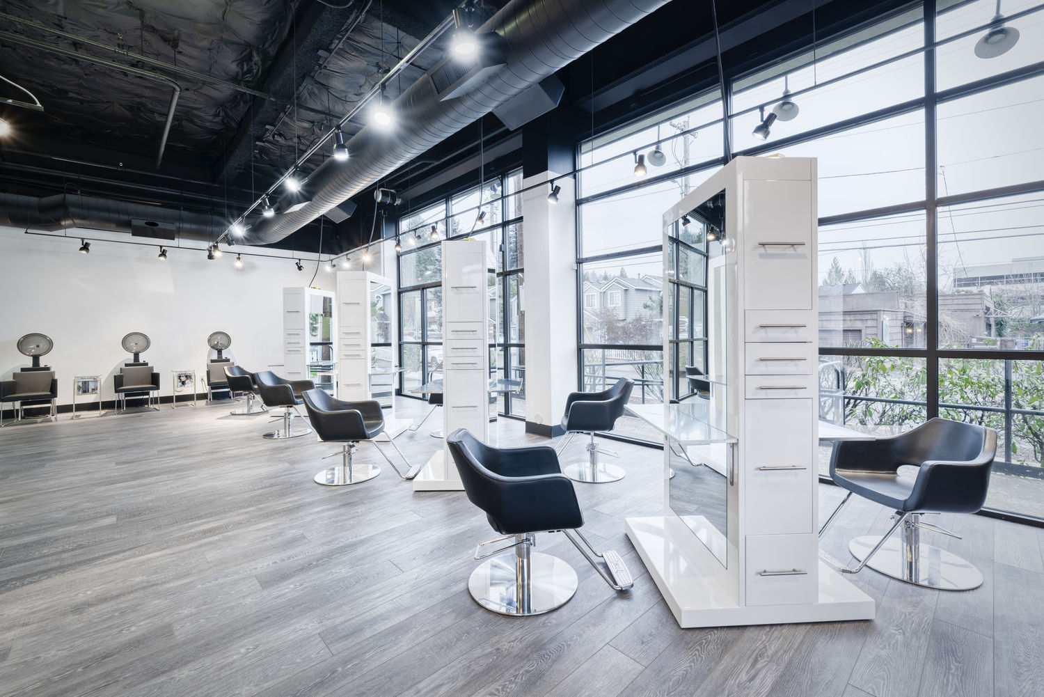 AGS Beauty takes pride in transforming hair salons into modern, stylish, and highly functional spaces. In this beautifully designed salon, our TAHITI double-sided salon stations, MOORE salon chairs, and CANON salon dryer chairs are featured prominently. The TAHITI salon stations, with their sleek white finish, offer ample storage and a chic look that enhances the salon’s aesthetic. Paired with the ergonomic and stylish MOORE salon chairs, clients can enjoy maximum comfort during their appointments. Additionally, the CANON salon dryer chairs provide both functionality and elegance, completing the salon's professional setup. This salon setup is perfect for businesses in the greater Portland, Oregon, and Seattle, Washington metropolitan areas. From the vibrant neighborhoods of Portland like Pearl District, Alberta Arts District, and Hawthorne to the bustling areas of Seattle such as Capitol Hill, Ballard, and Queen Anne, AGS Beauty’s salon furniture elevates the client experience. Our products are designed to meet the demands of busy salons while providing an inviting atmosphere. For salon owners in Vancouver, WA, Beaverton, OR, and Bellevue, WA, looking to upgrade their spaces, the combination of TAHITI stations, MOORE chairs, and CANON dryer chairs is an ideal choice. These pieces not only enhance the salon's look but also ensure durability and comfort, making them a valuable investment.